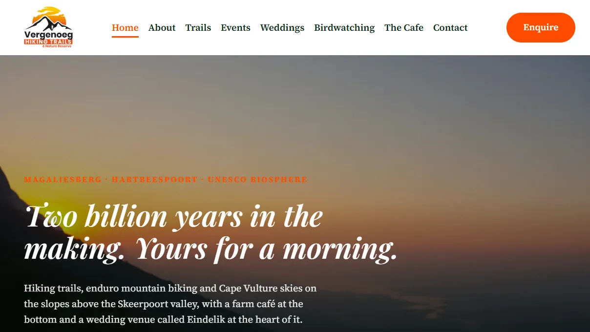 The new Vergenoeg homepage: a full-width sunset over the ridge and the headline “Two billion years in the making. Yours for a morning.”